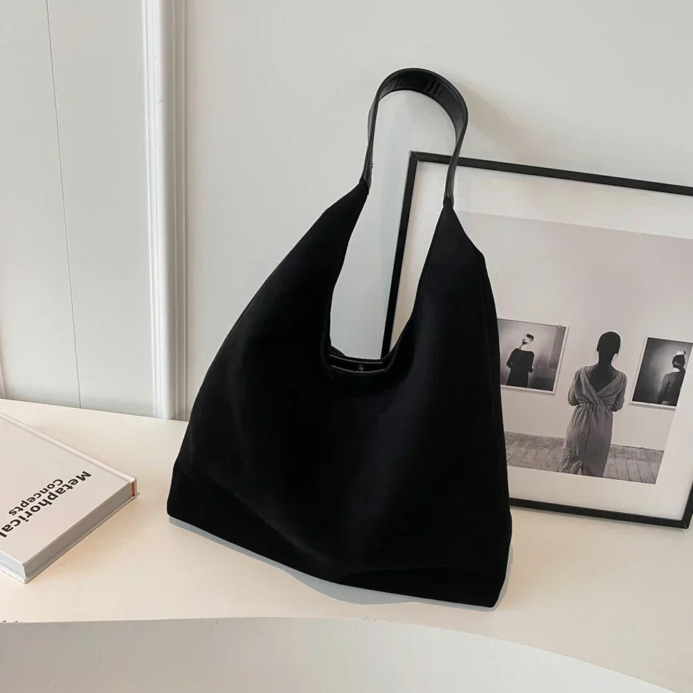 freja™ – myk skulderveske i semsket stil